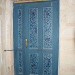 Inside the back door.